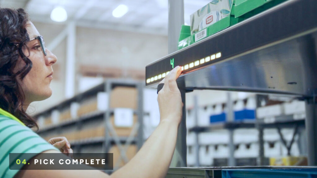 Put-to-light Lumabot shelves display order quantity and container, human presses button to confirm completion of task.